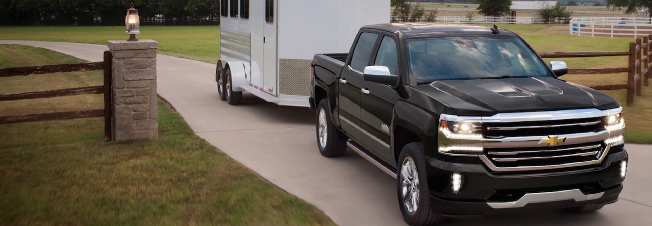 A 2018 Chevy Silverado 1500 towing a trailer