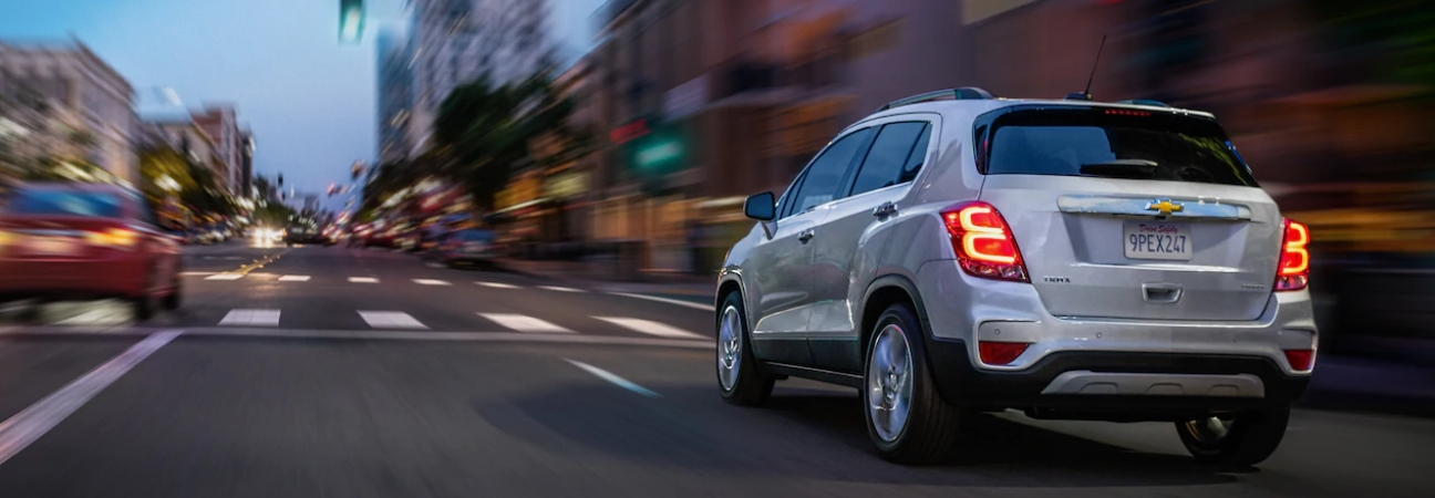 Silver 2019 Chevrolet Trax driving city streets